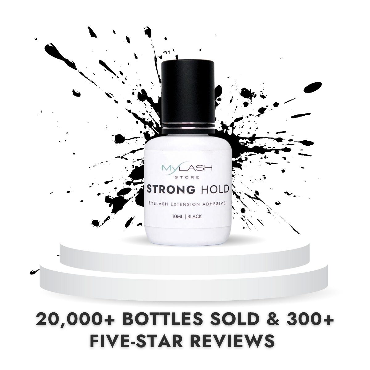 White bottle of eyelash extension adhesive with black cap on a white background