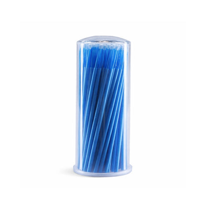 Clear cylindrical container filled with blue blue micro brushes white background