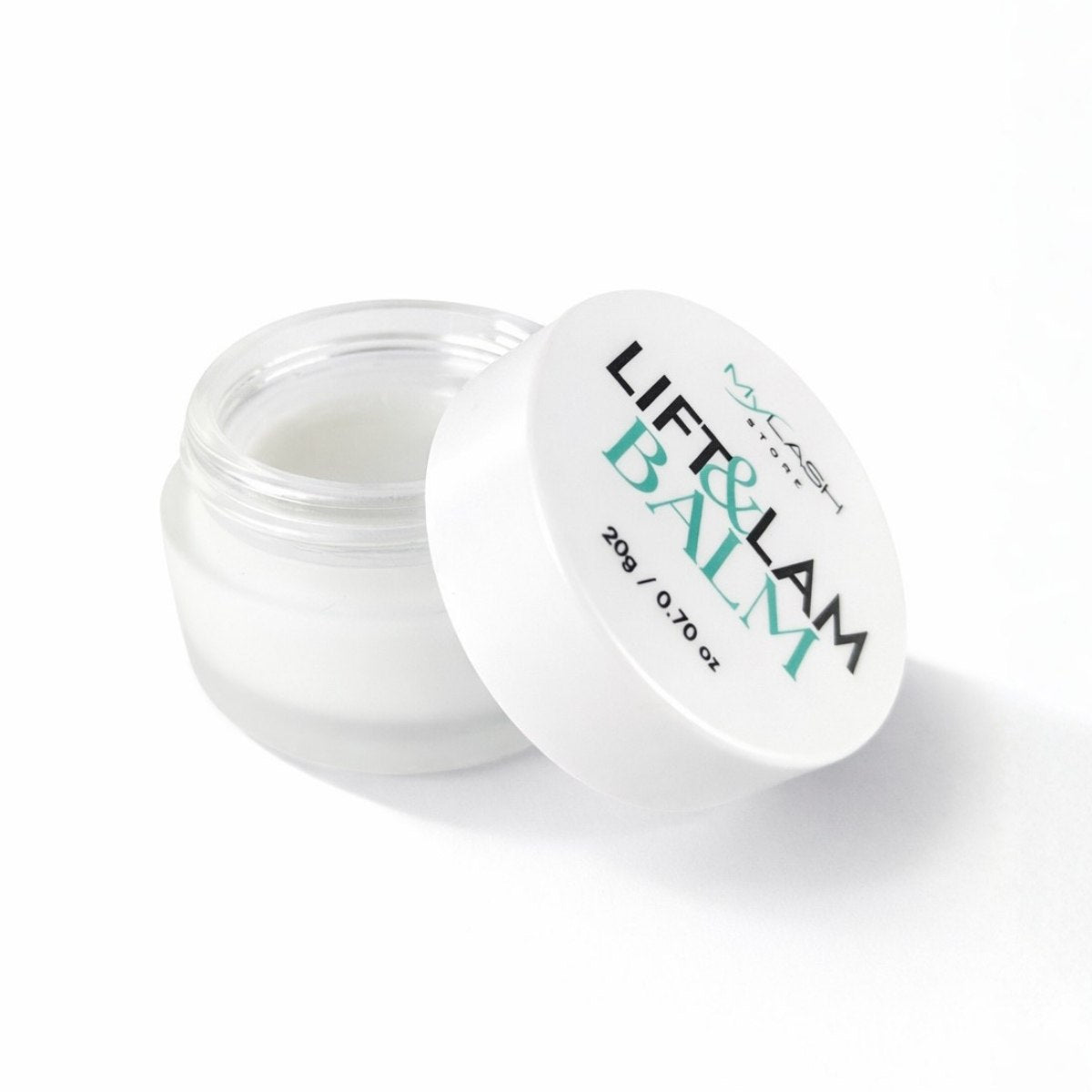 Open jar of Lift &amp; Balm on a white background