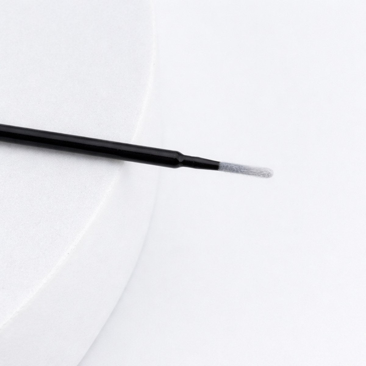 Long tip micro brush close up on white background
