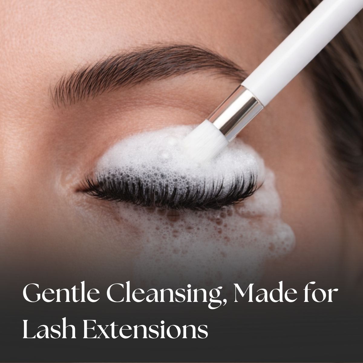 Person applying a lash cleanser to their eyelashes with a brush, text &