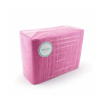 Packaged lash pillow head covers in pink with a visible brand label on a white background